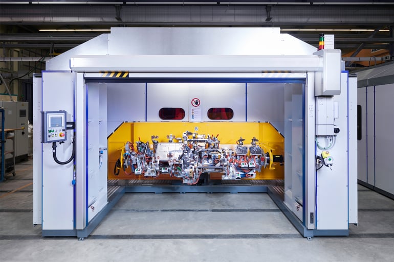 Automatisierte Fügeanlagen: Produktionssystem für das MIG Schweißen einer Sitzbaugruppe
